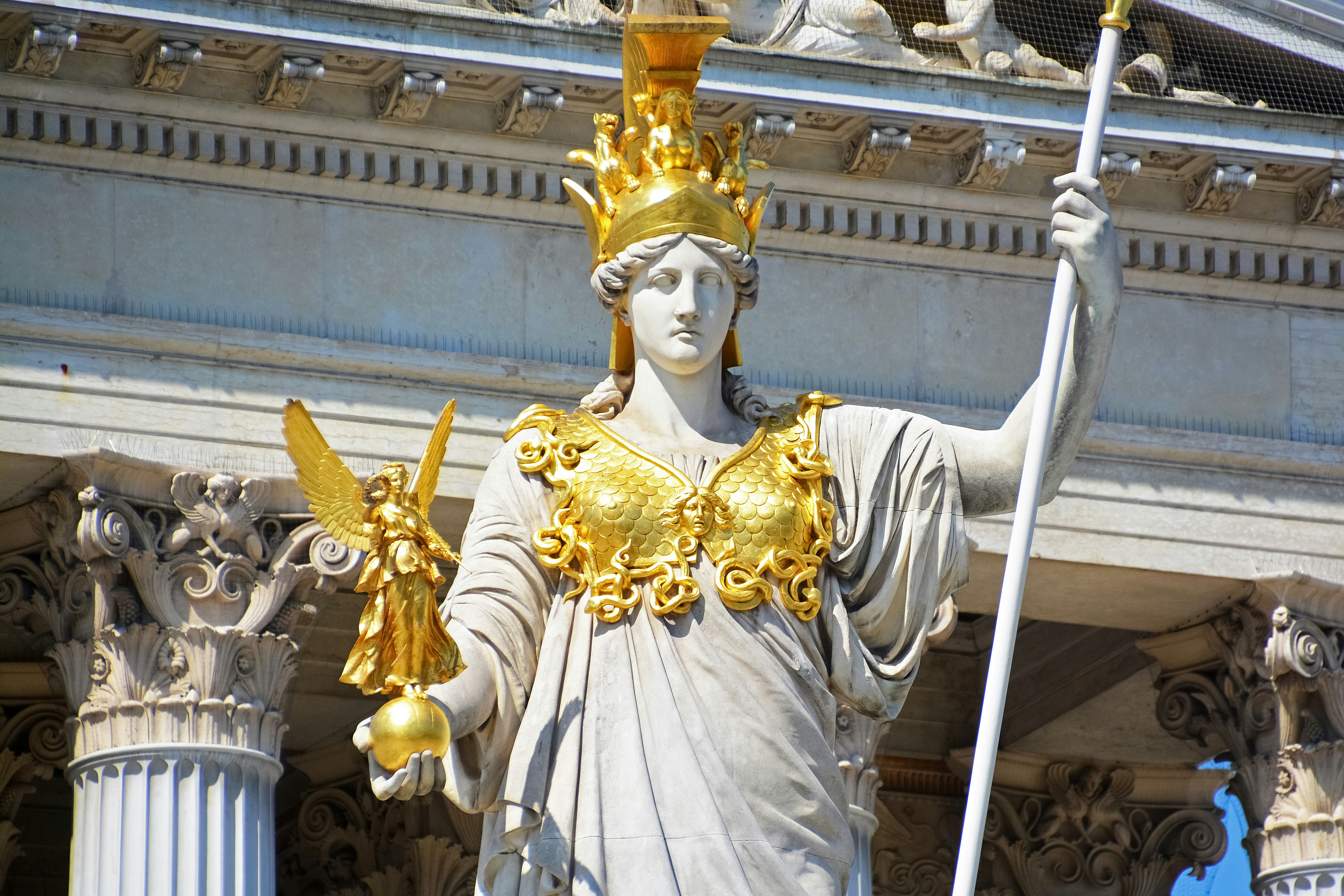 gold hindu deity statue during daytime